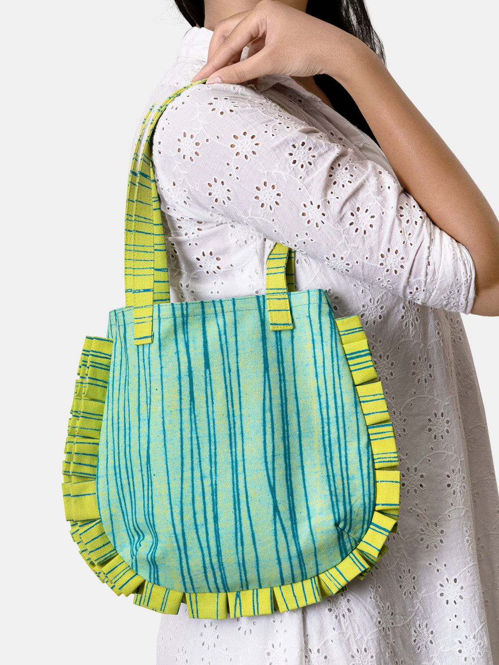 Green and blue striped handbag with ruffled edges