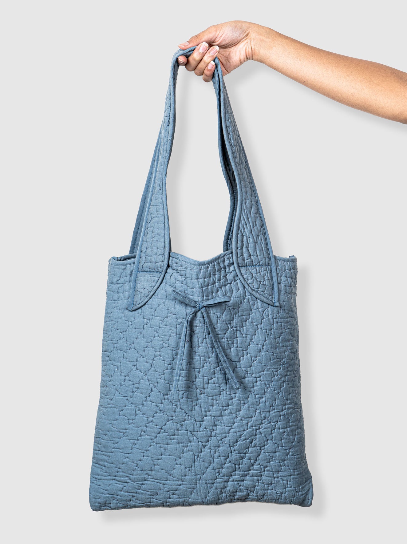 Blue quilted tote bag