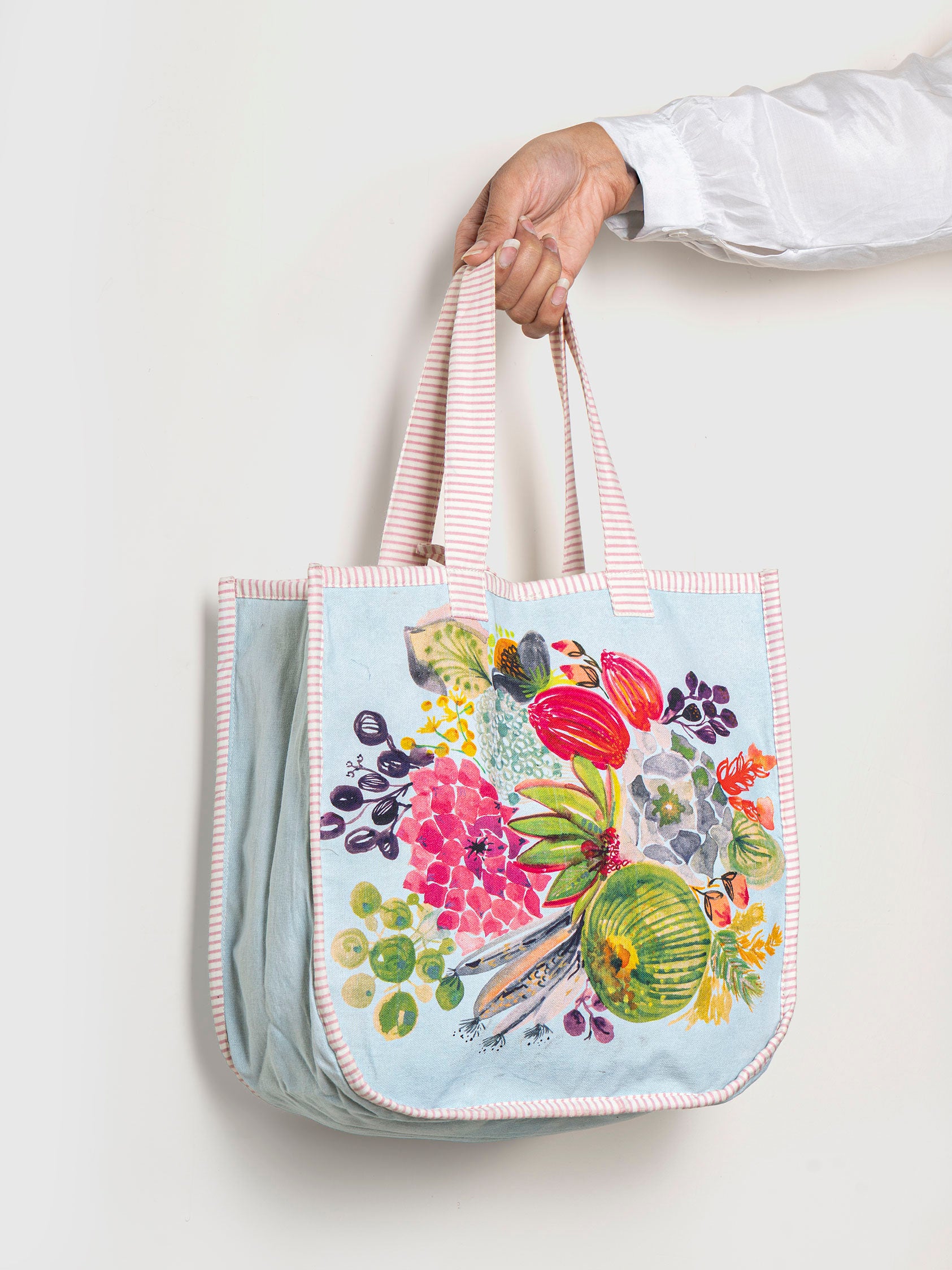 a floral tote bag with a colorful design