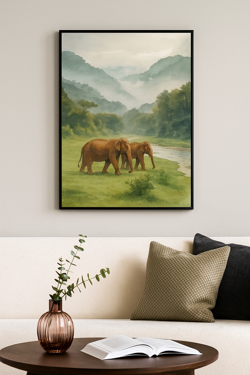 Framed artwork of two elephants in a landscape on a wall above a sofa.