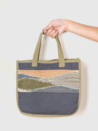 a tote bag with a patterned design on a white background