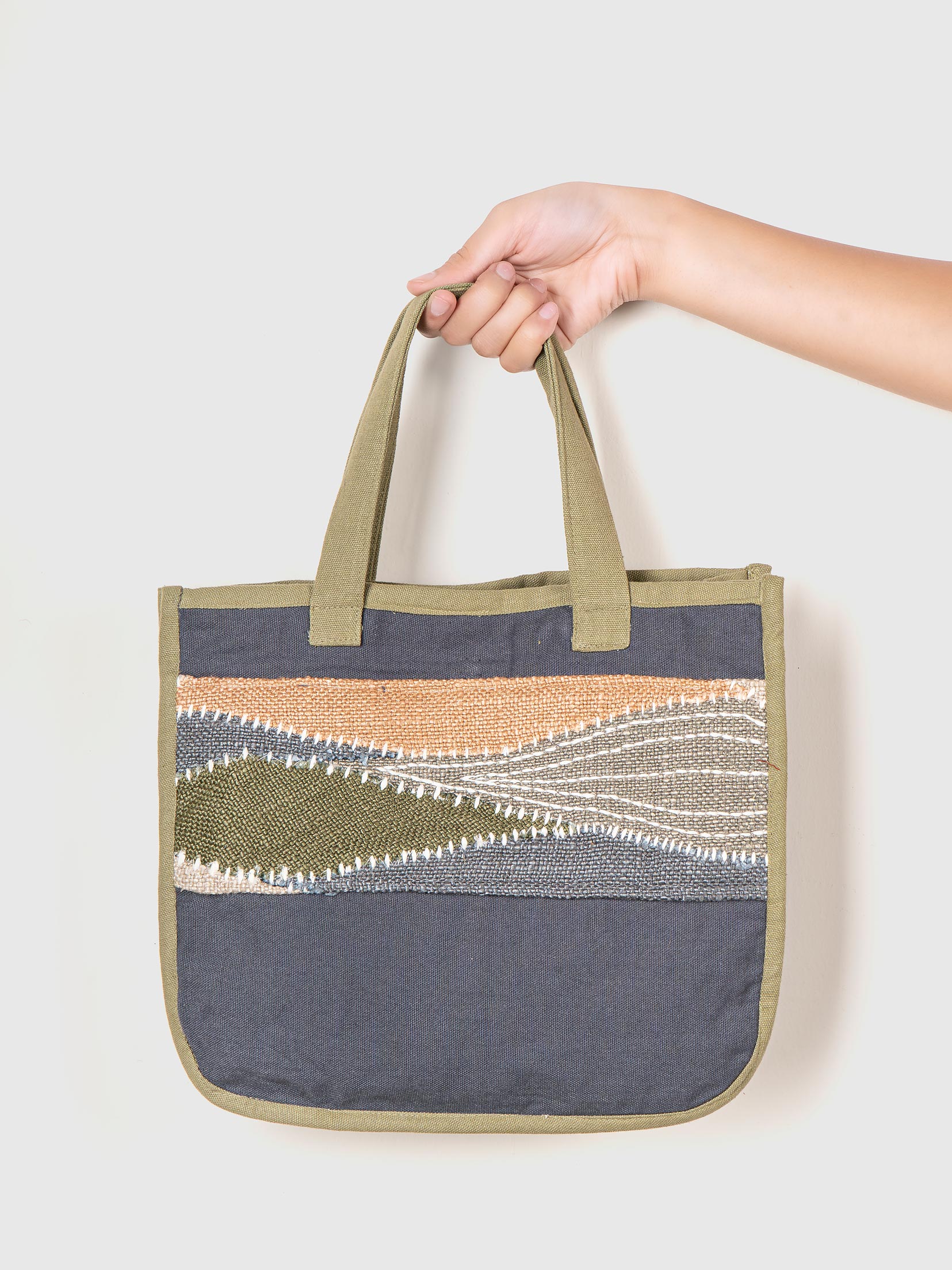 a tote bag with a patterned design on a white background